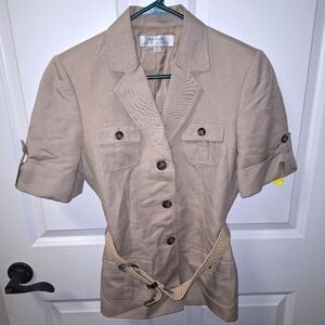 A Tahari short sleeve button-down top with a waist belt. Pre-loved